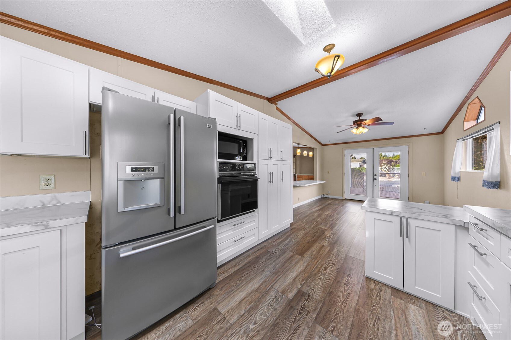 3802 James Street, Unit 23 Bellingham, WA 98226 - Photo 8 of 34 a kitchen with stainless steel appliances granite countertop a refrigerator and a stove top oven
