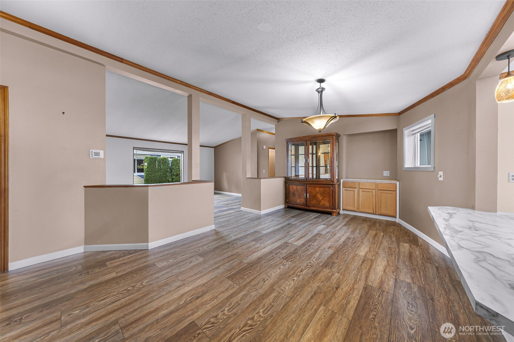 3802 James Street, Unit 23 Bellingham, WA 98226 - Photo 10 of 34 a view of a big room with wooden floor windows and kitchen view