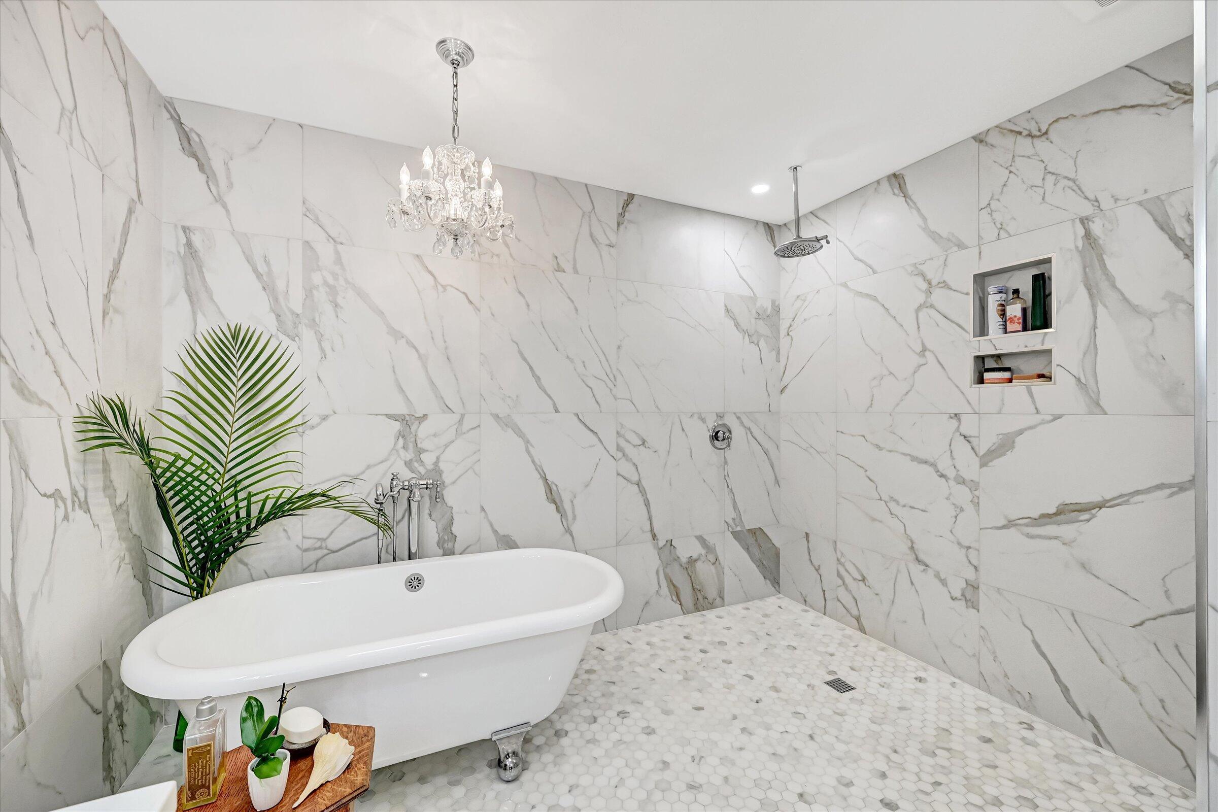 535 Augusta Boulevard, Unit 4 Naples, FL 34113 - Photo 33 of 44 a bathroom with a sink a toilet and shower