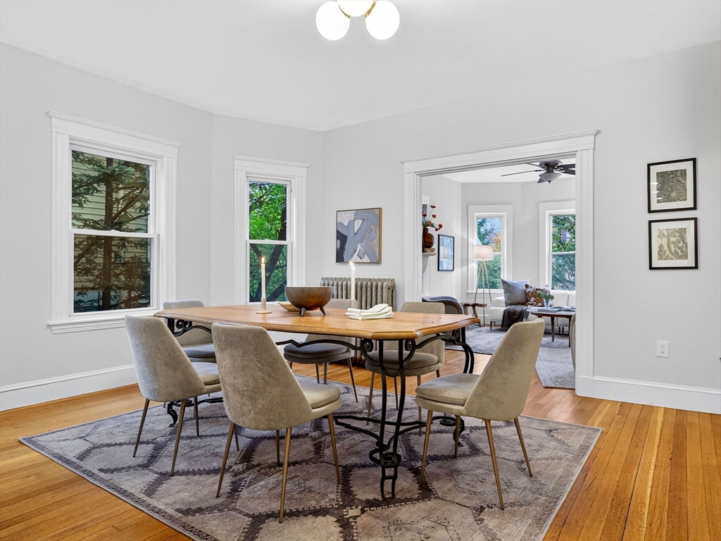47 Roslin Street, Unit ONE Boston, MA 02124 - Photo 13 of 34 a view of a dining room with furniture window and wooden floor