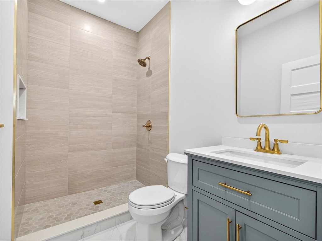 47 Roslin Street, Unit ONE Boston, MA 02124 - Photo 29 of 34 a bathroom with a sink toilet and shower