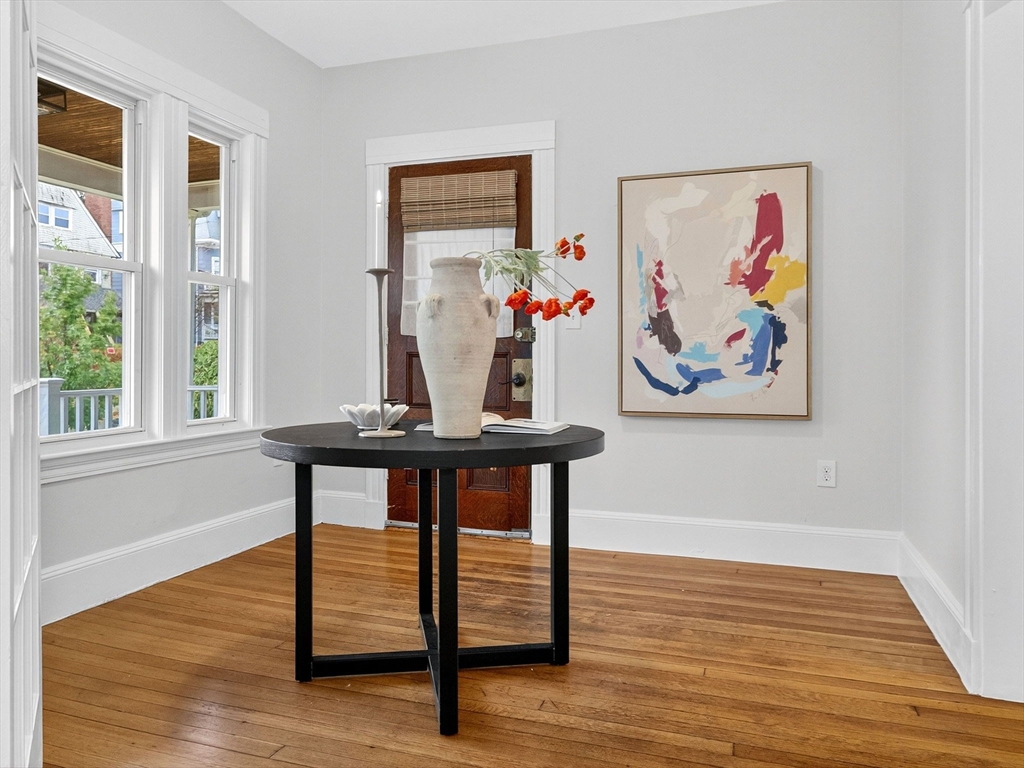 47 Roslin Street, Unit ONE Boston, MA 02124 - Photo 6 of 34 a view of a livingroom with furniture window and wooden floor