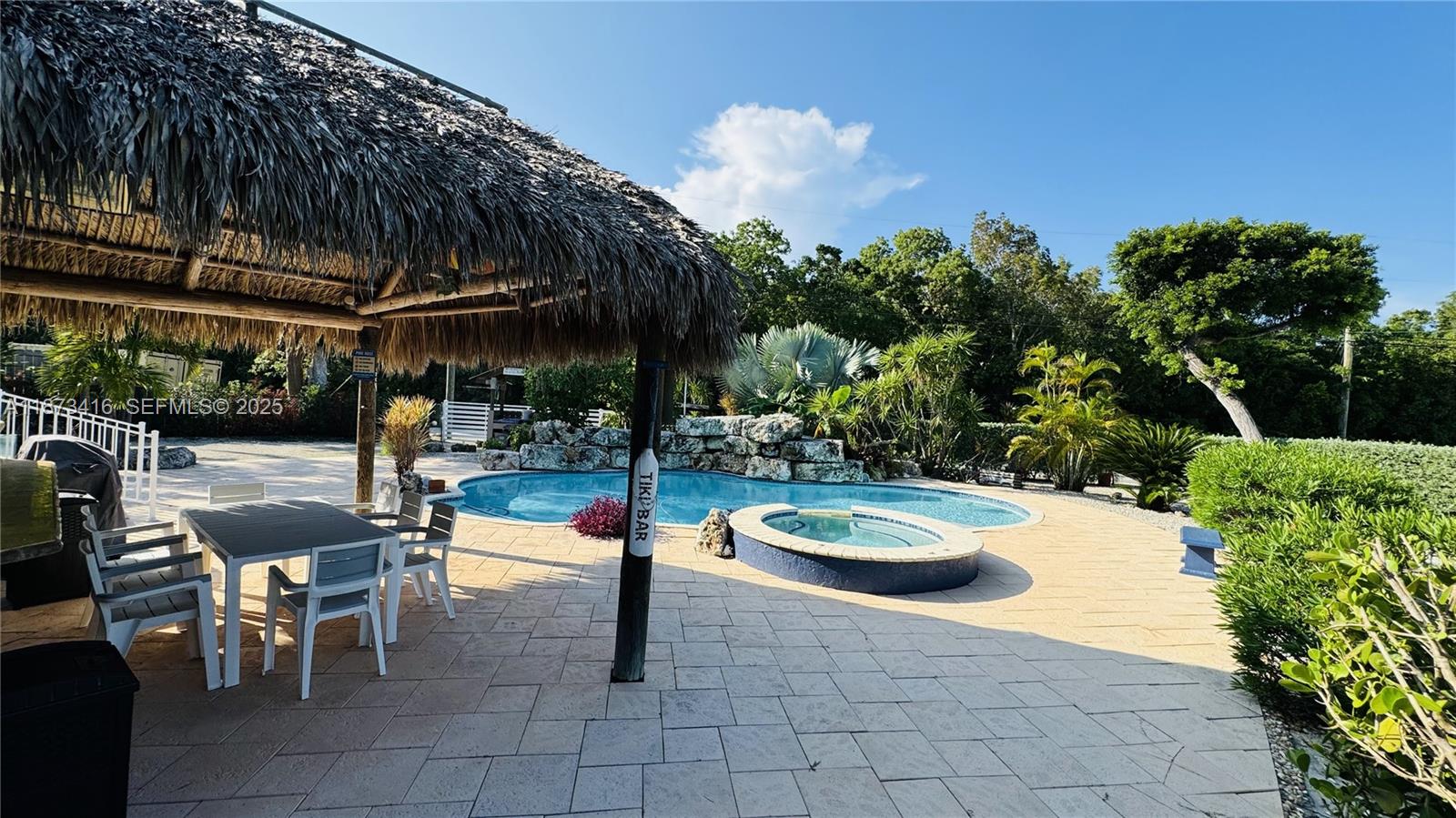443 4th Road, Unit MAIN Key Largo, FL 33037 - Photo 1 of 31 a view of a swimming pool with a patio