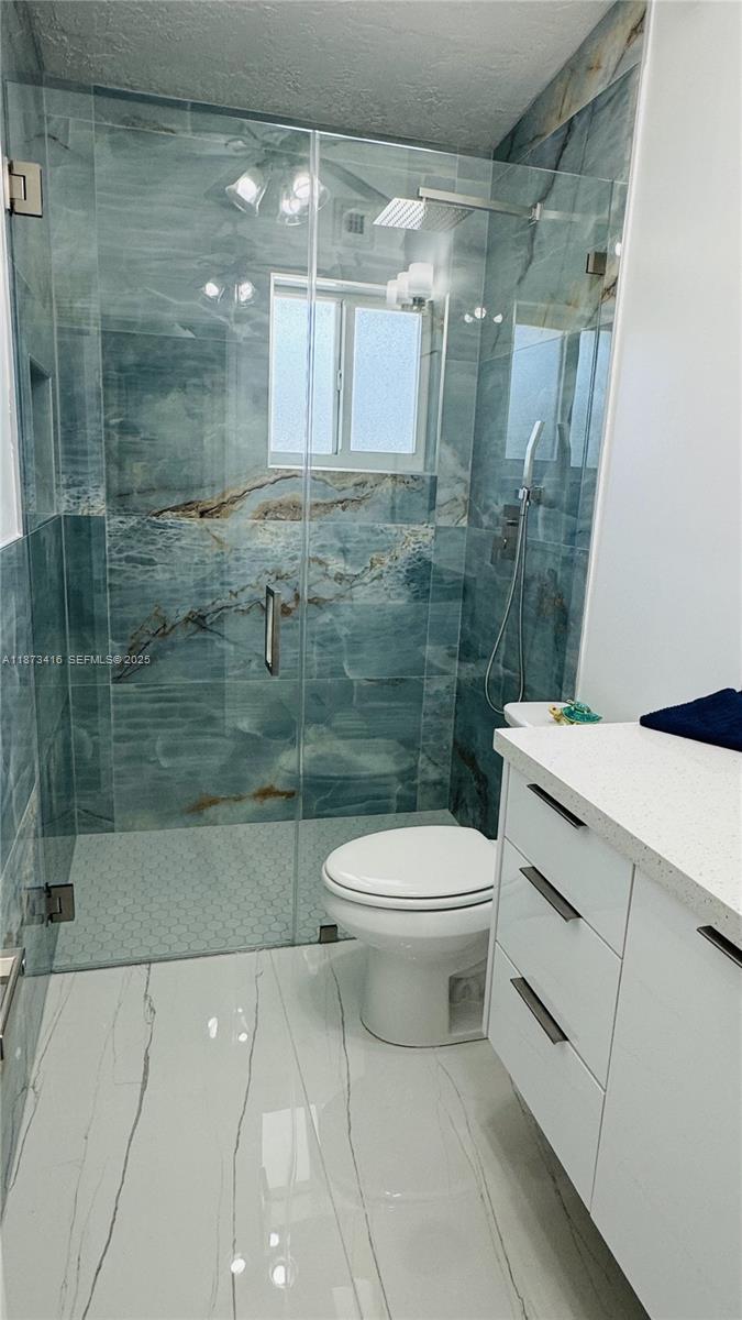 443 4th Road, Unit MAIN Key Largo, FL 33037 - Photo 14 of 31 a bathroom with a toilet sink and shower