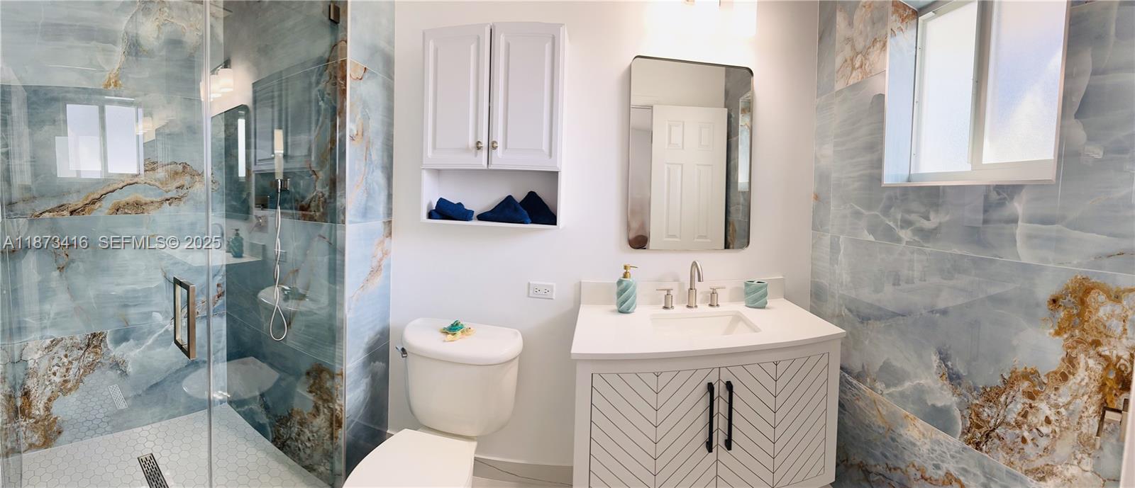 443 4th Road, Unit MAIN Key Largo, FL 33037 - Photo 21 of 31 a bathroom with a sink a toilet and shower