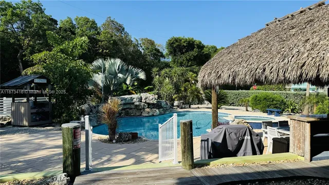 a view of a swimming pool with a patio