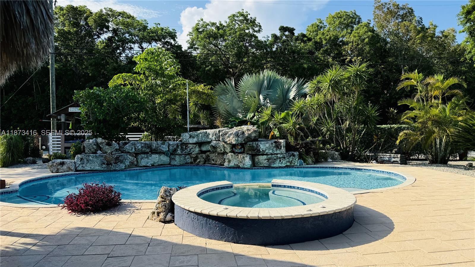443 4th Road, Unit MAIN Key Largo, FL 33037 - Photo 28 of 31 a view of a swimming pool with a patio