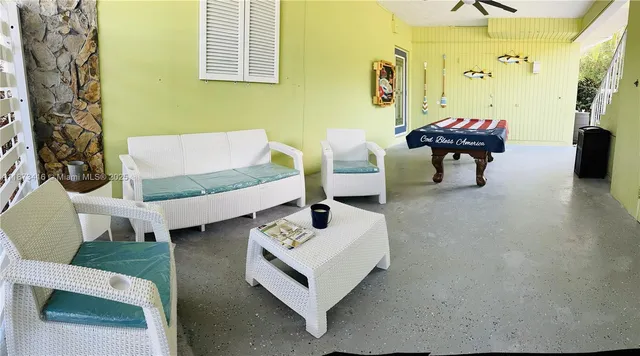 a bed sitting in a room next to a window