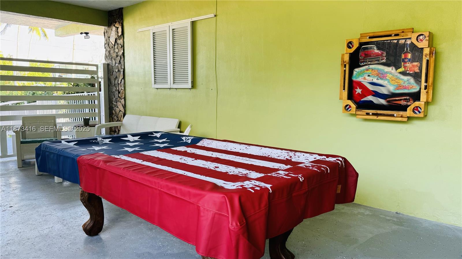 443 4th Road, Unit MAIN Key Largo, FL 33037 - Photo 31 of 31 a bed sitting in a room next to a window