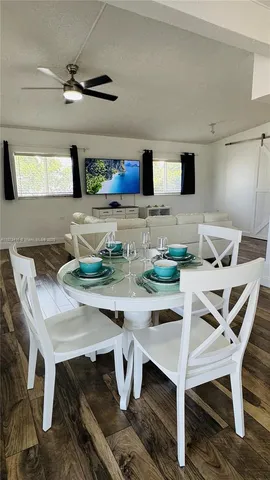 a kitchen with a table and chairs in it