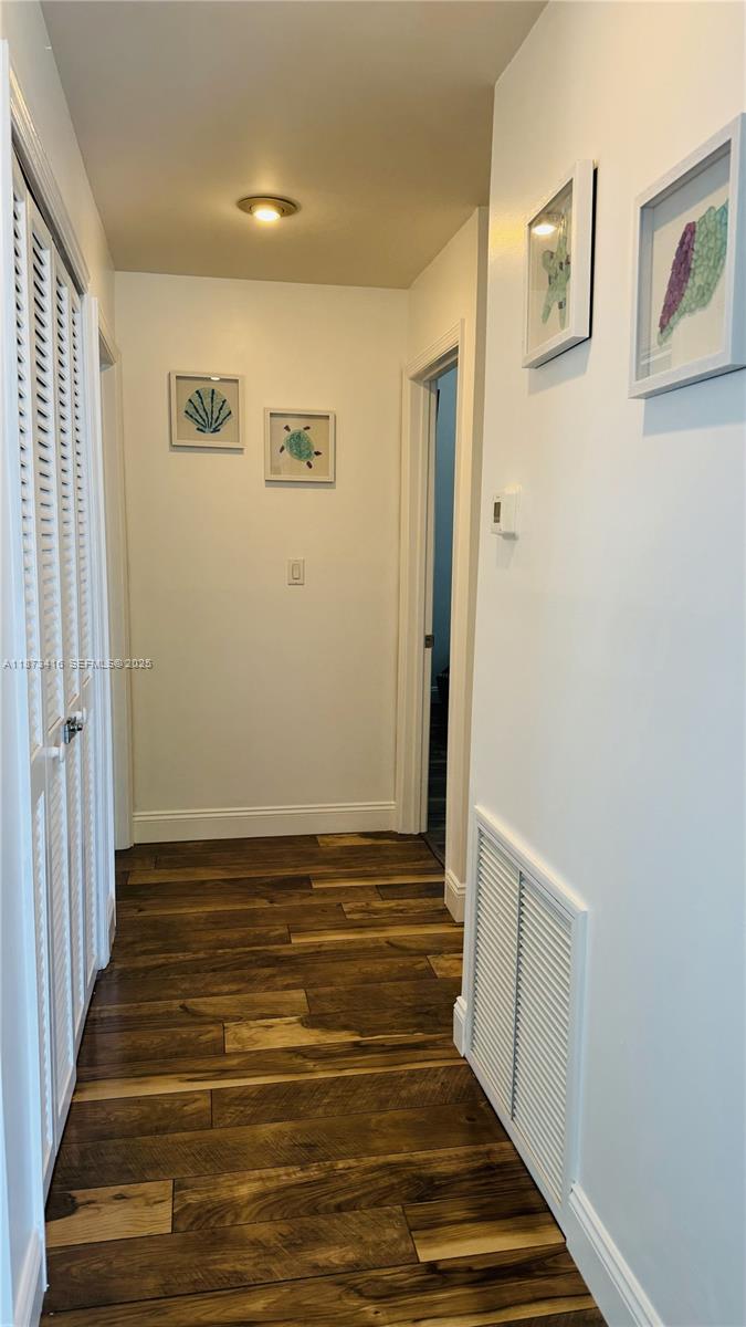 443 4th Road, Unit MAIN Key Largo, FL 33037 - Photo 8 of 31 a view of room with wooden floor and staircase