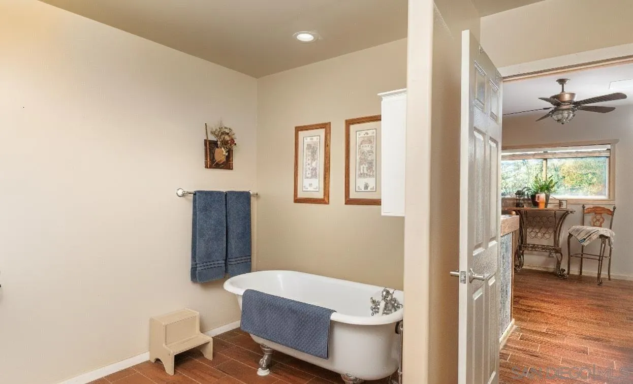 31141 Saddleback Road Valley Center, CA 92082 - Photo 7 of 23 a bathroom with a sink a toilet a window and shower