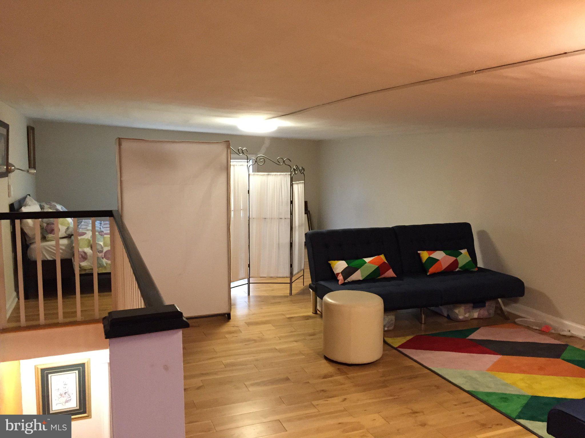 527 South 7th Street, Unit 1 Philadelphia, PA 19147 - Photo 5 of 11 Cozy loft with vibrant accents.