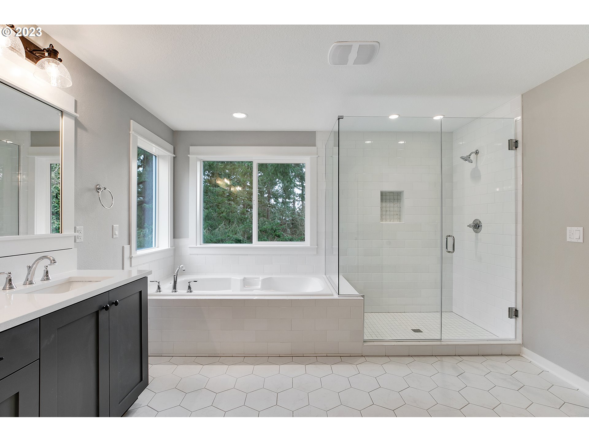 8651 Southwest 42nd Avenue Portland, OR 97219 - Photo 17 of 30 a bathroom with a bathtub and a sink
