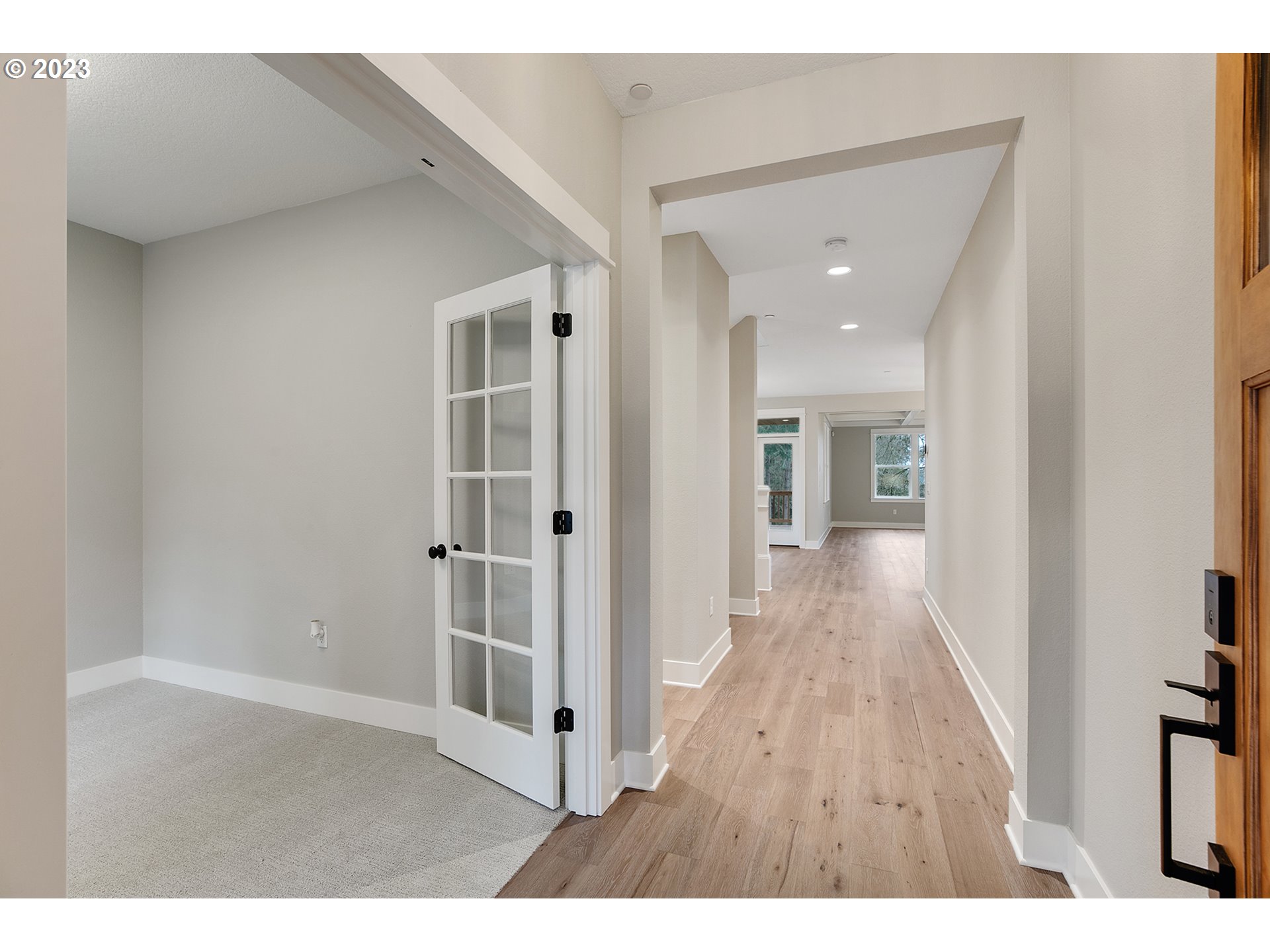 8651 Southwest 42nd Avenue Portland, OR 97219 - Photo 2 of 30 a view of a hallway with wooden floor