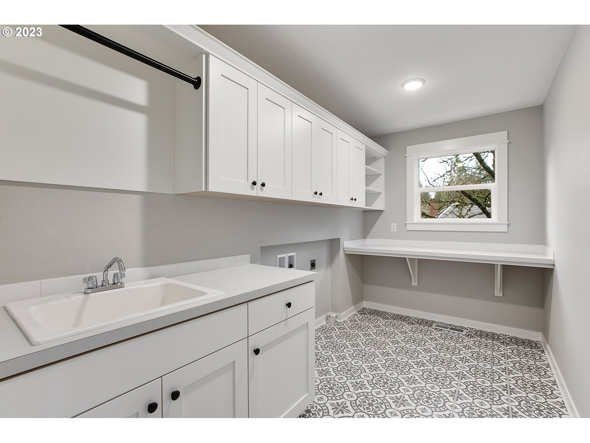 8651 Southwest 42nd Avenue Portland, OR 97219 - Photo 21 of 30 a kitchen with a sink cabinets and window