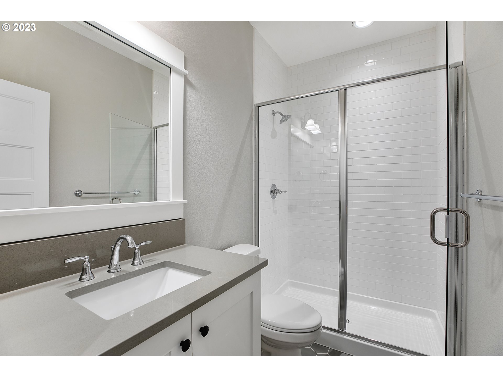 8651 Southwest 42nd Avenue Portland, OR 97219 - Photo 23 of 30 a bathroom with a granite countertop sink mirror and double