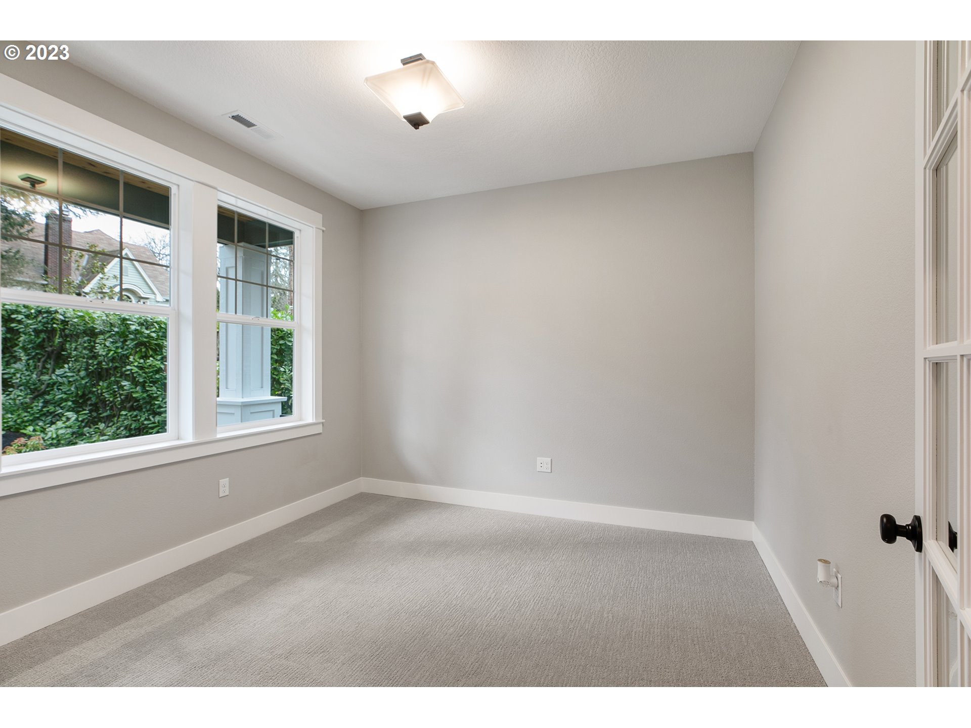 8651 Southwest 42nd Avenue Portland, OR 97219 - Photo 3 of 30 a view of an empty room with a window