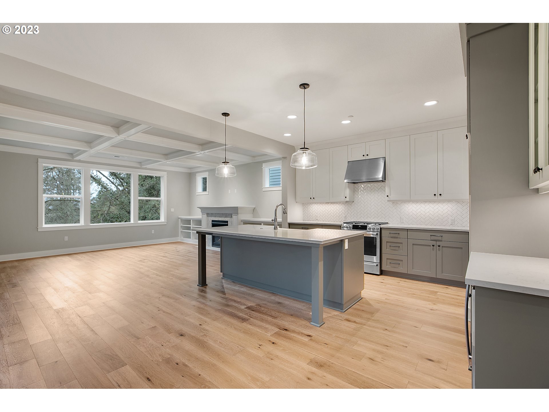 8651 Southwest 42nd Avenue Portland, OR 97219 - Photo 4 of 30 a kitchen with kitchen island sink stove and refrigerator