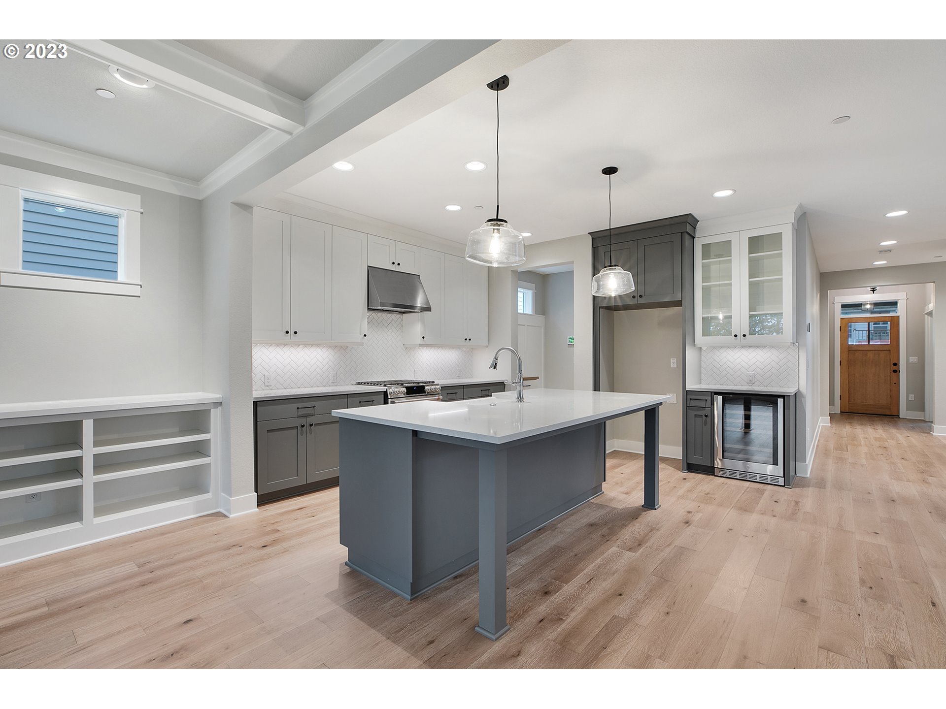 8651 Southwest 42nd Avenue Portland, OR 97219 - Photo 6 of 30 a kitchen with kitchen island a sink stainless steel appliances and cabinets