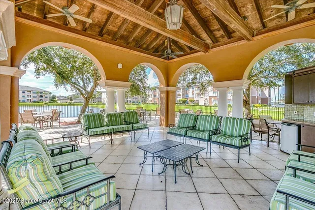 a view of a chairs and table in a patio