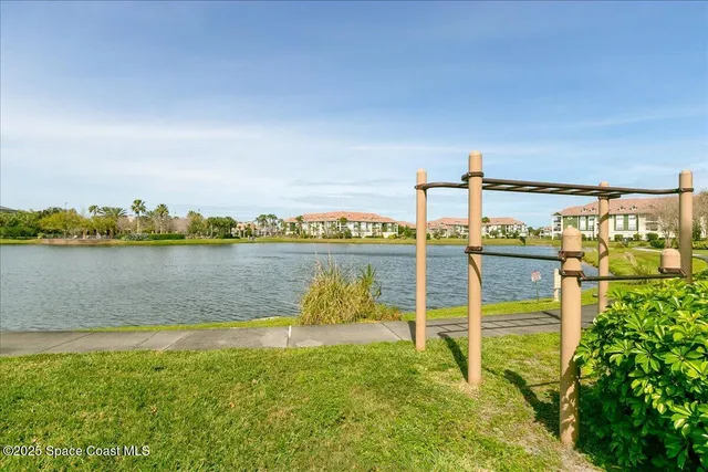 a view of a lake with a chairs