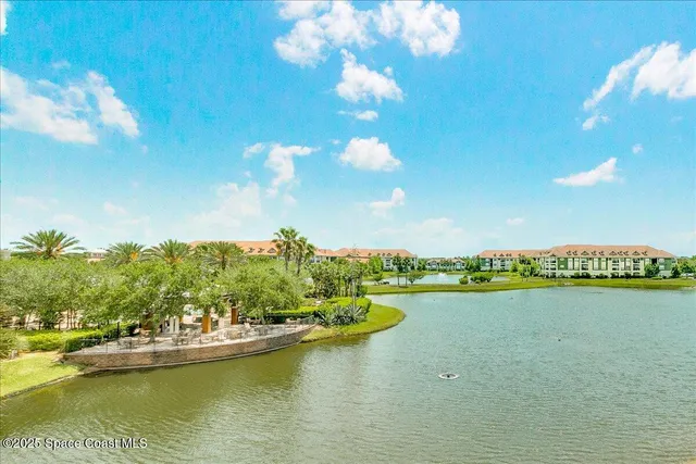a view of a city with swimming pool and lake view