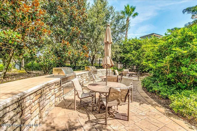 a view of an outdoor space with a table and chairs