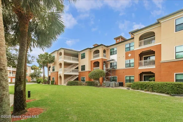 a view of a building with a yard