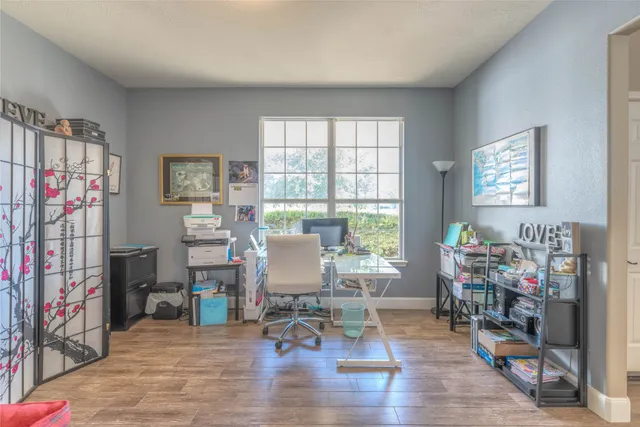 a living room with furniture and a window