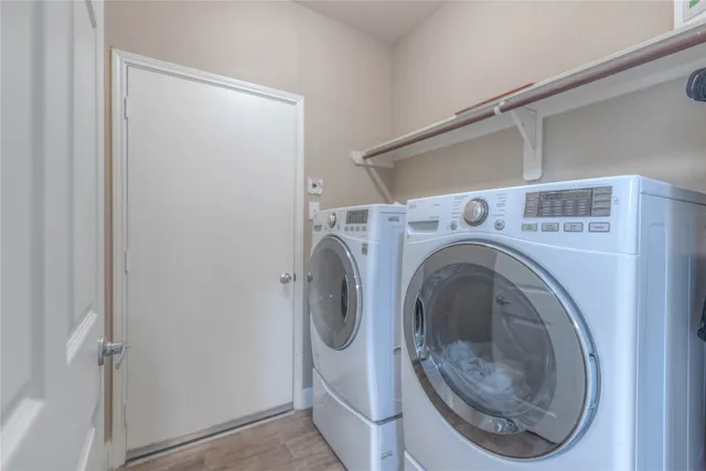 a utility room with dryer and washer