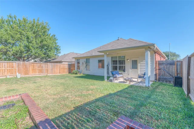 a front view of a house with a garden and porch