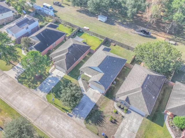 an aerial view of a house with a garden