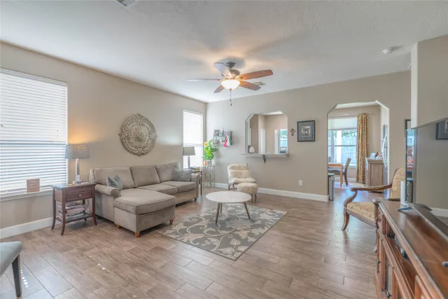 a living room with furniture and a large window