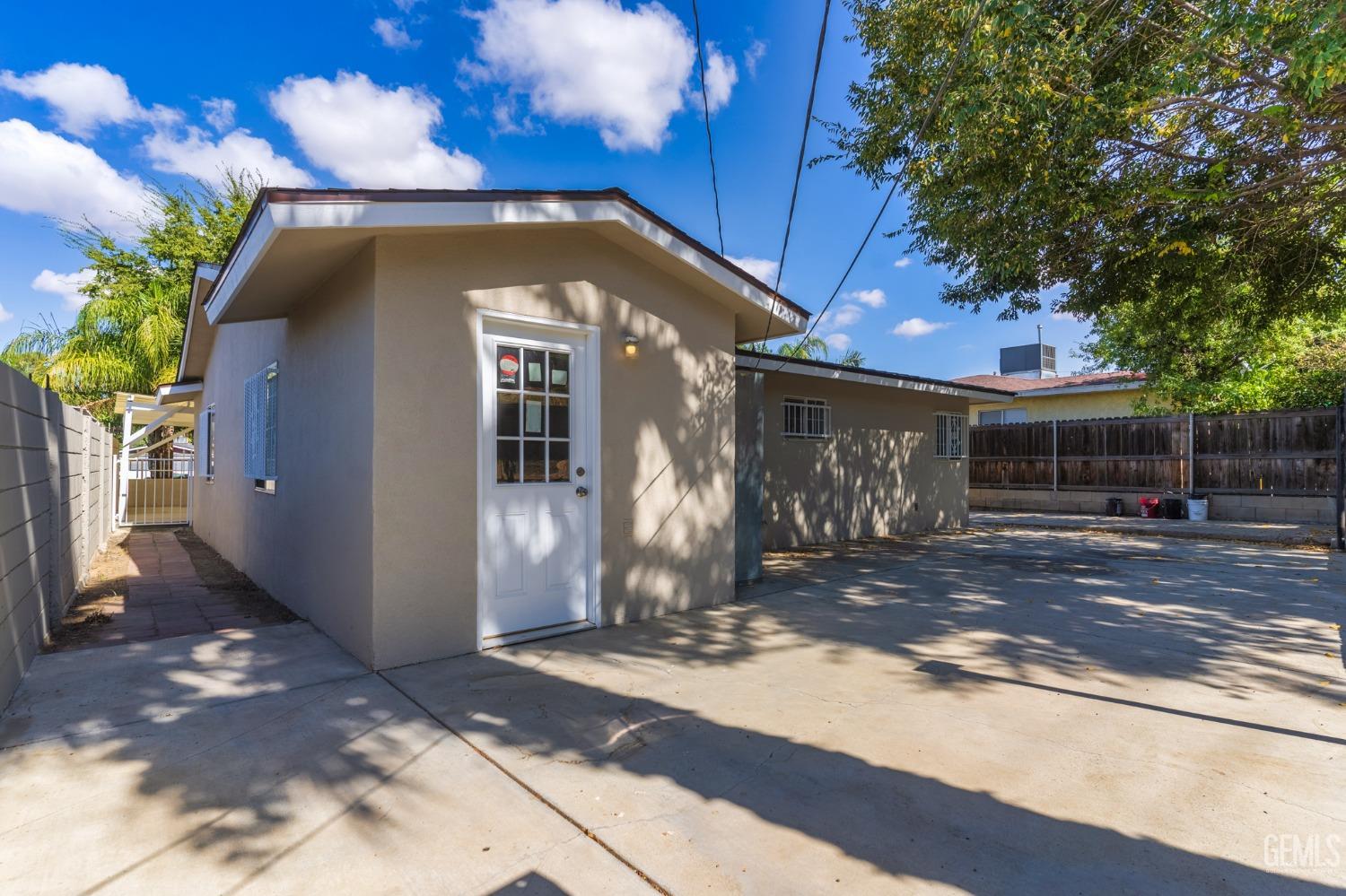 Undisclosed Address Bakersfield, CA 93305 - Photo 16 of 21 a front view of a house with a yard