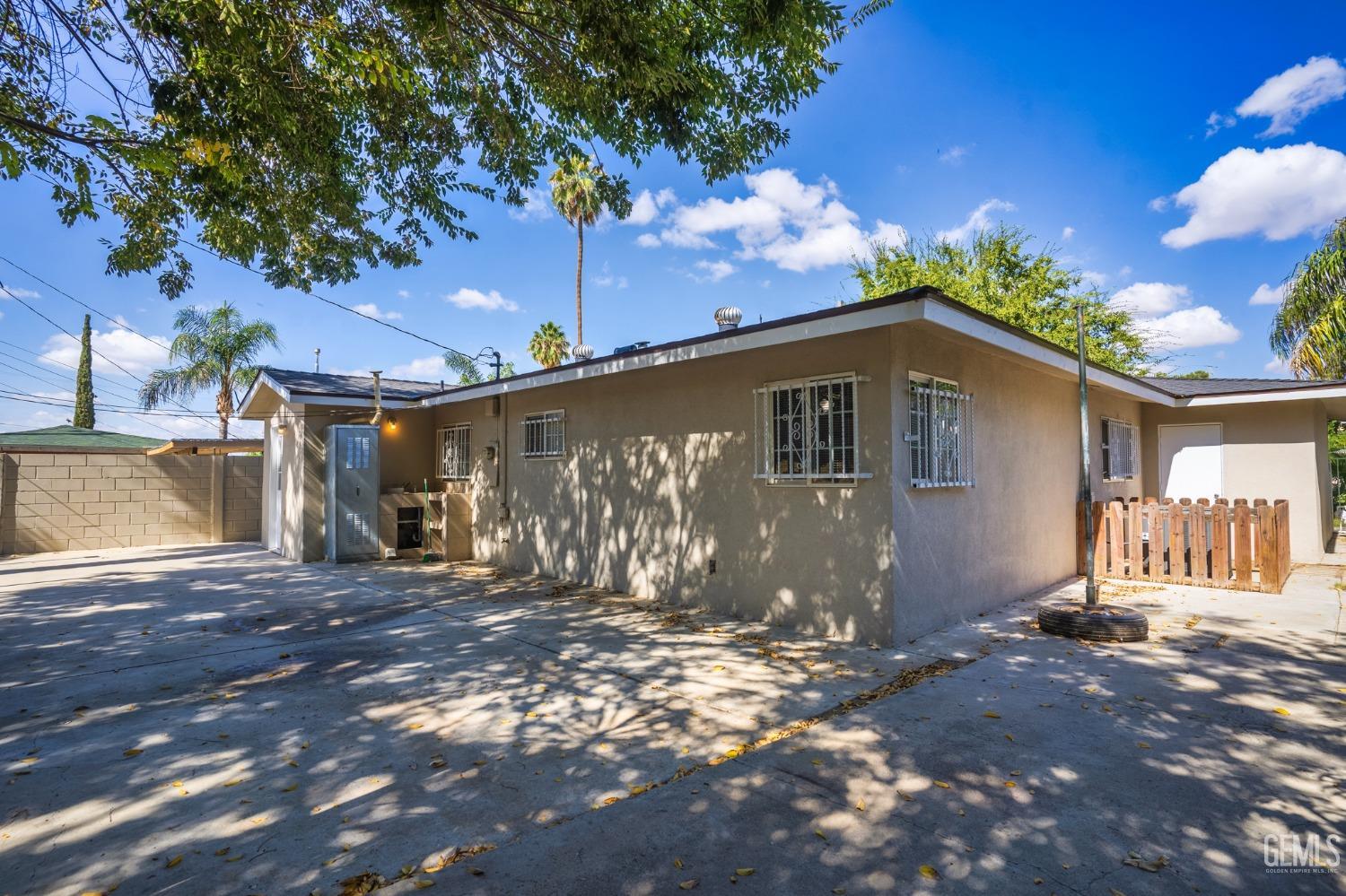 Undisclosed Address Bakersfield, CA 93305 - Photo 17 of 21 a front view of a house with a yard