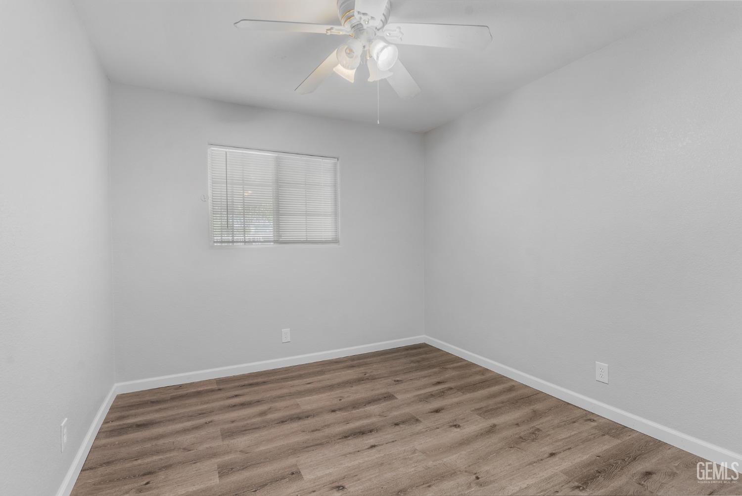 Undisclosed Address Bakersfield, CA 93305 - Photo 7 of 21 wooden floor in an empty room