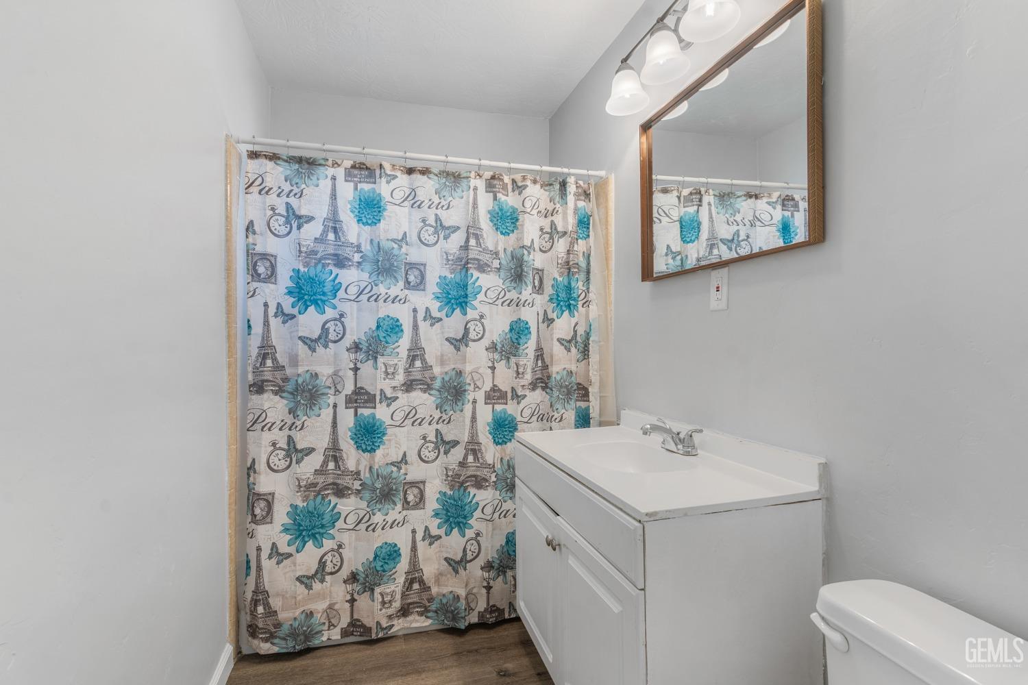 Undisclosed Address Bakersfield, CA 93305 - Photo 9 of 21 a bathroom with a sink and a mirror