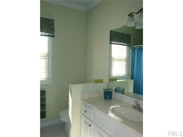 2845 Anfield Road Raleigh, NC 27606 - Photo 13 of 25 First Floor Full Bath with Large Vanity and Crown Moulding is Conveniently Located Between the Two Bedrooms Bathroom