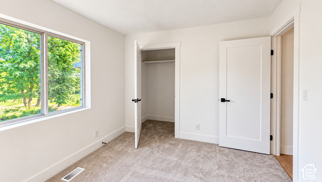 342 East 600 North Logan, UT 84321 - Photo 19 of 19 Carpeted flooring, white walls, double-pane window, flush panel doors, and matte black hardware