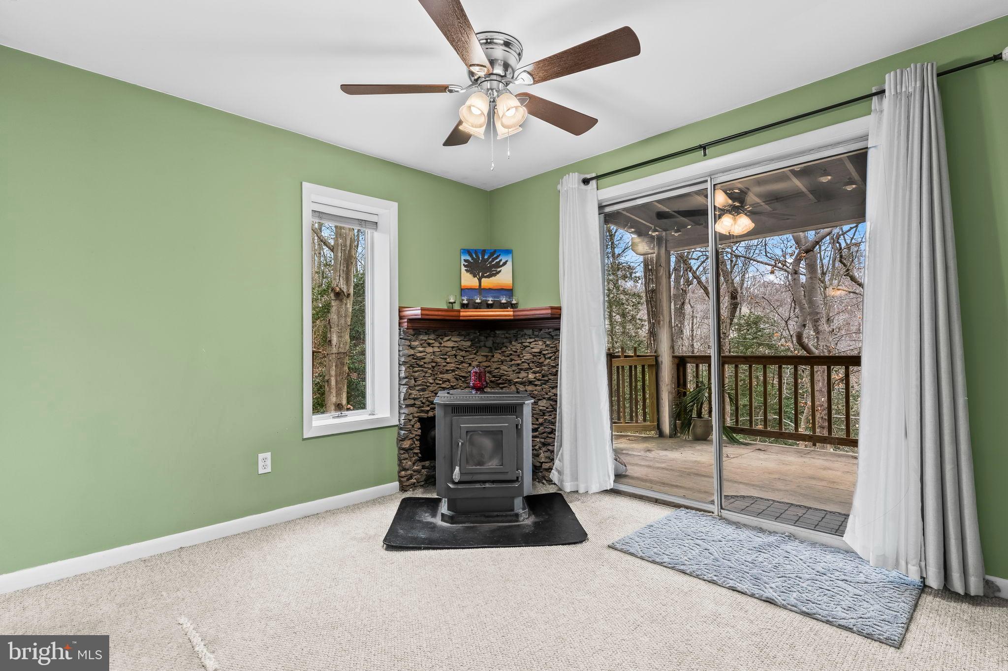 285 Red Cloud Road Lusby, MD 20657 - Photo 16 of 39 Cozy retreat with nature views and warmth.