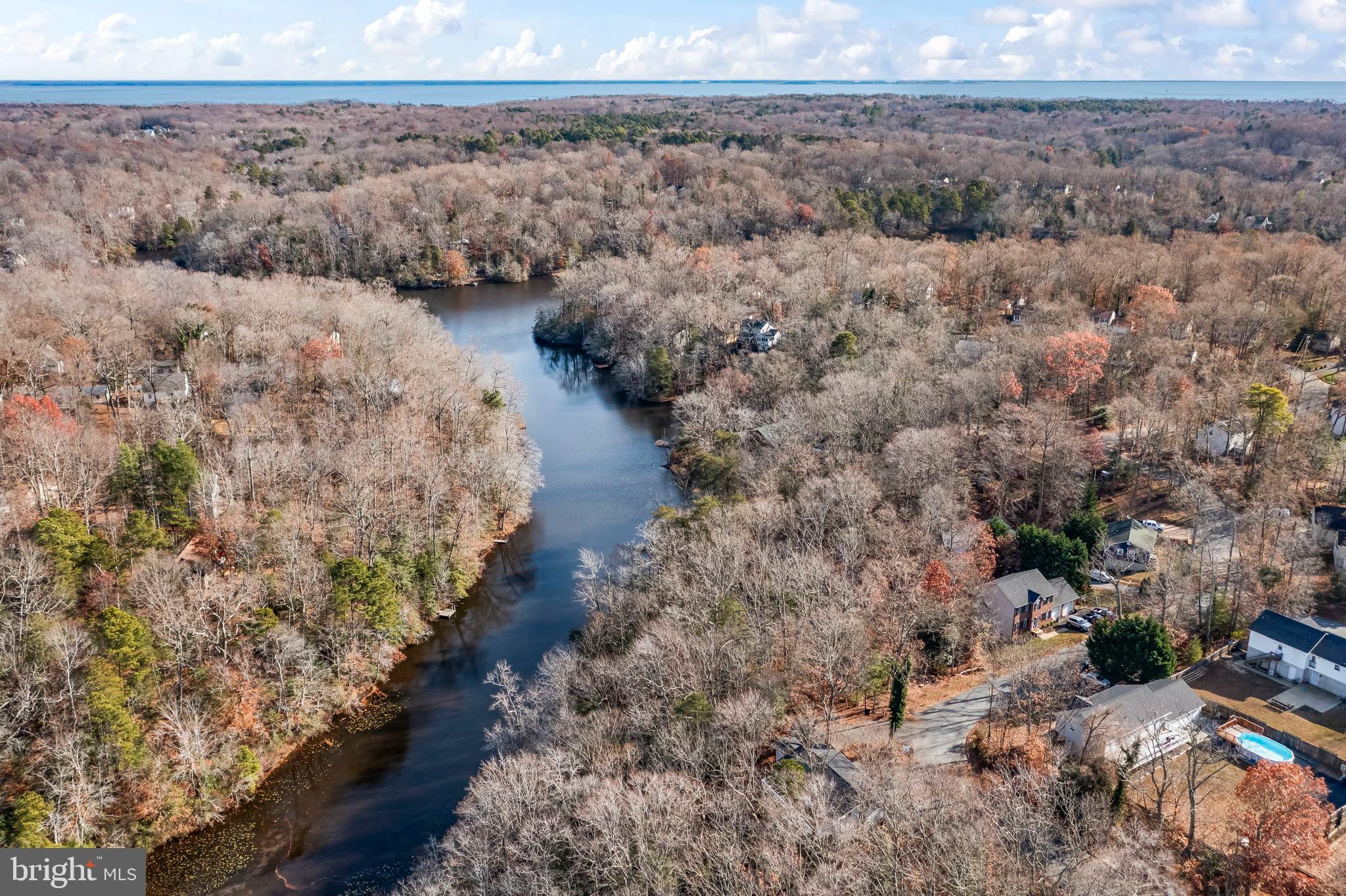 285 Red Cloud Road Lusby, MD 20657 - Photo 29 of 39 Serene river winding through autumn woods.