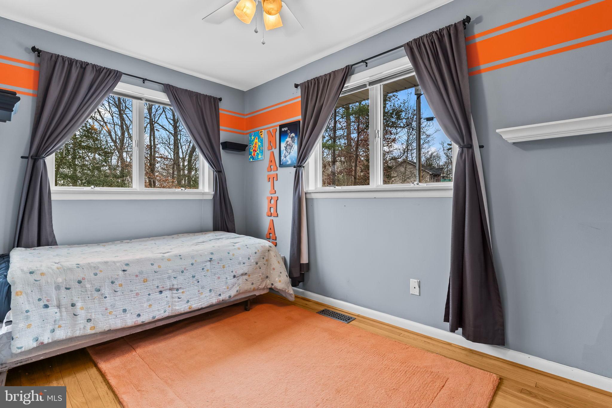 285 Red Cloud Road Lusby, MD 20657 - Photo 9 of 39 Bright and cheerful bedroom with nature views.