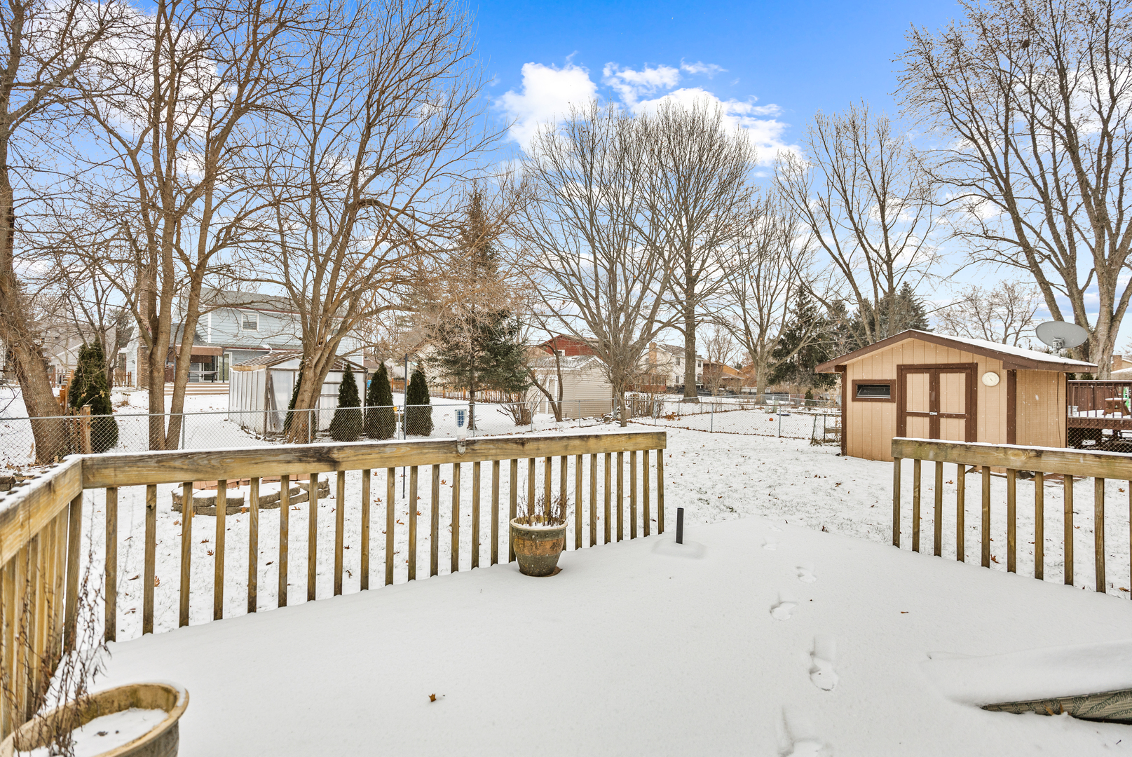 720 Ash Street Algonquin, IL 60102 - Photo 23 of 25 a view of a white house with a yard and covered with snow