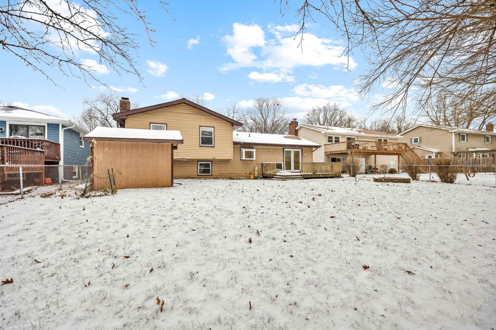 720 Ash Street Algonquin, IL 60102 - Photo 24 of 25 a front view of a house with a yard covered in snow