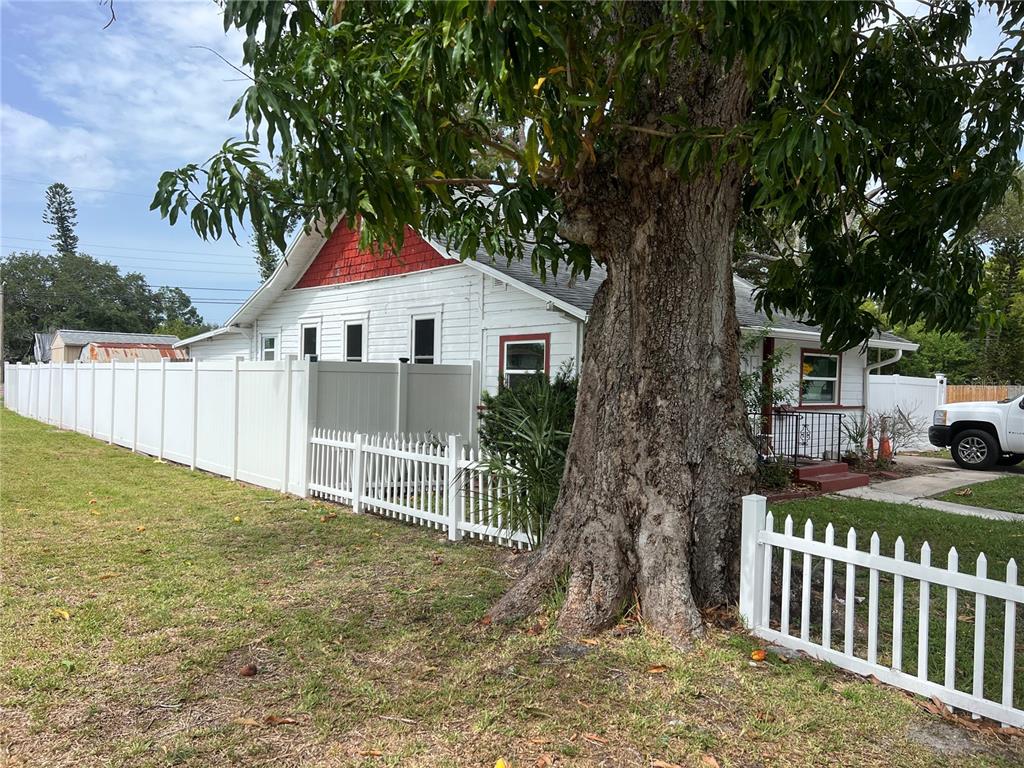 526 14th Avenue South St. Petersburg, FL 33701 - Photo 2 of 10 a white house that has a tree in front of it