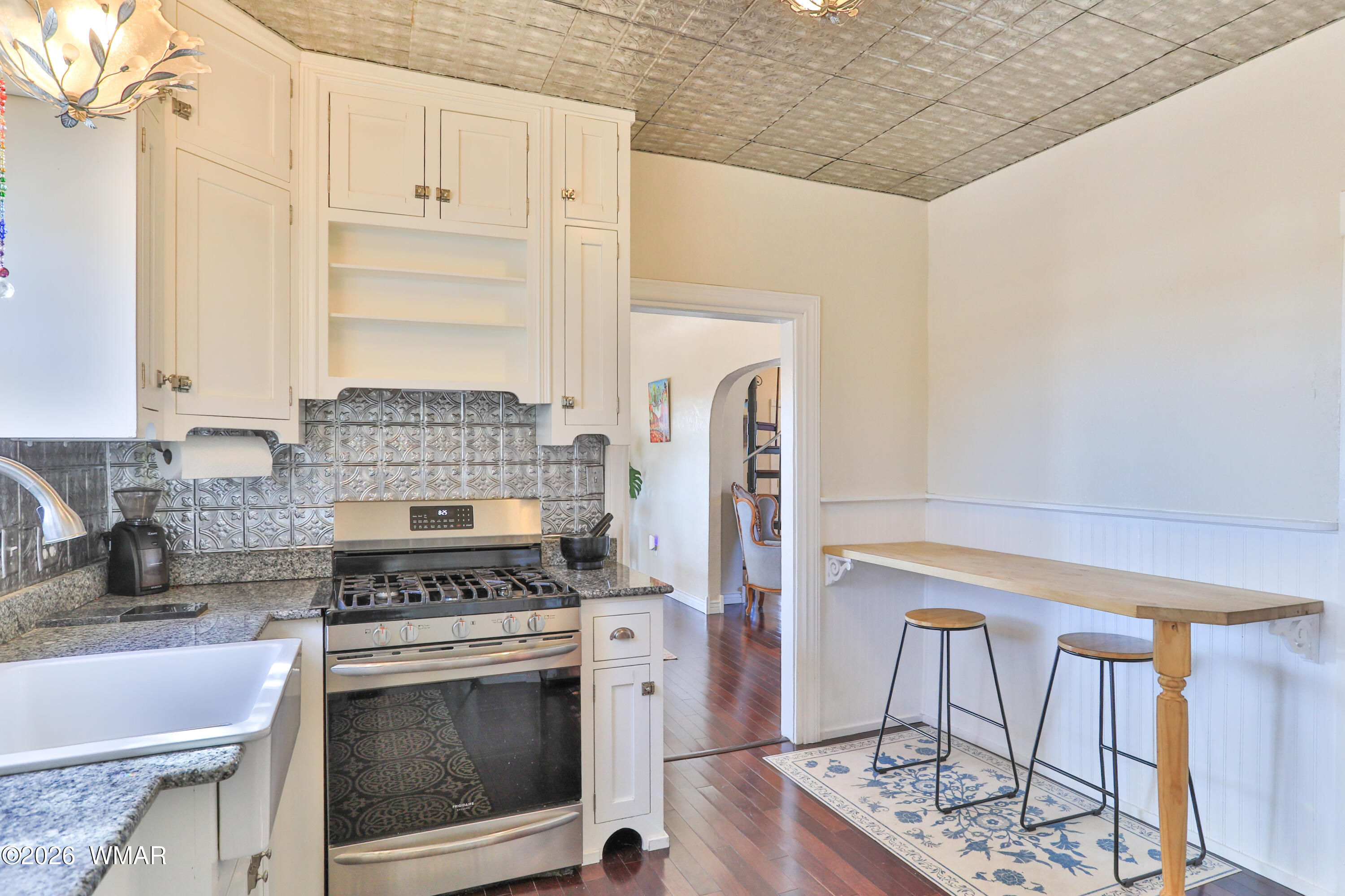 102 Crestview Road Holbrook, AZ 86025 - Photo 13 of 55 a kitchen with stainless steel appliances granite countertop a stove and a refrigerator