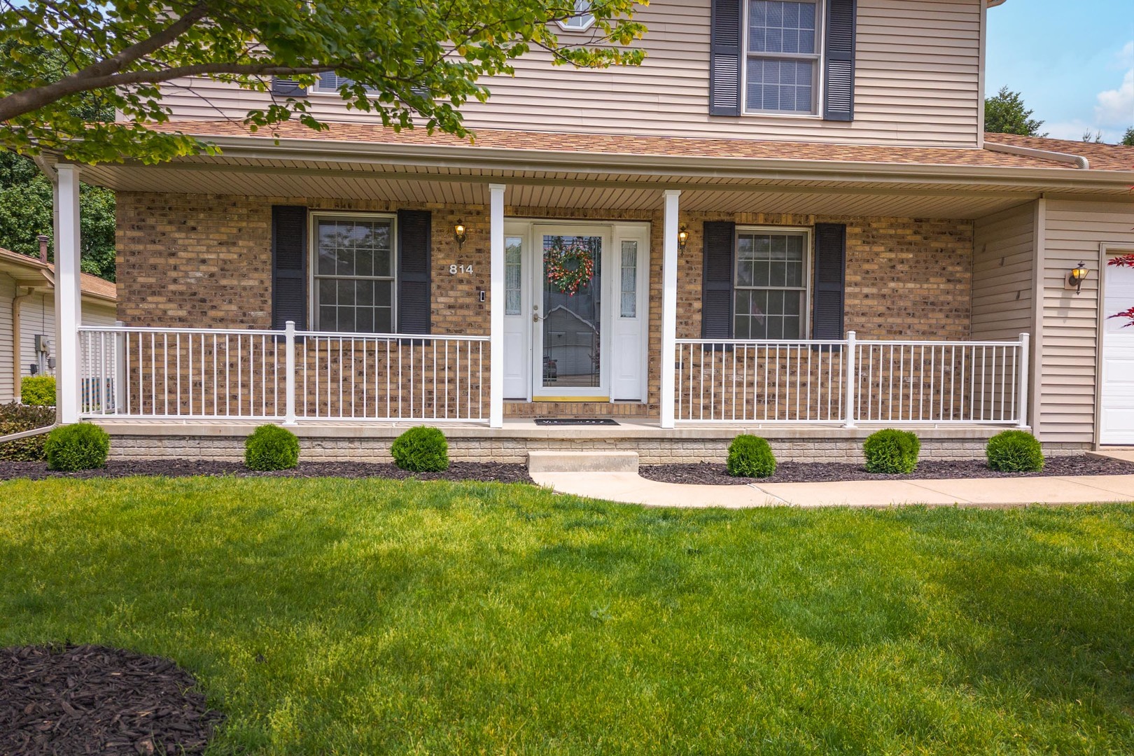 814 Landau Lane Normal, IL 61761 - Photo 3 of 58 a view of a house with a backyard and a garden