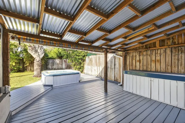 a view of porch with wooden floor