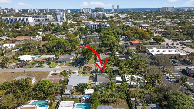 an aerial view of residential houses with outdoor space
